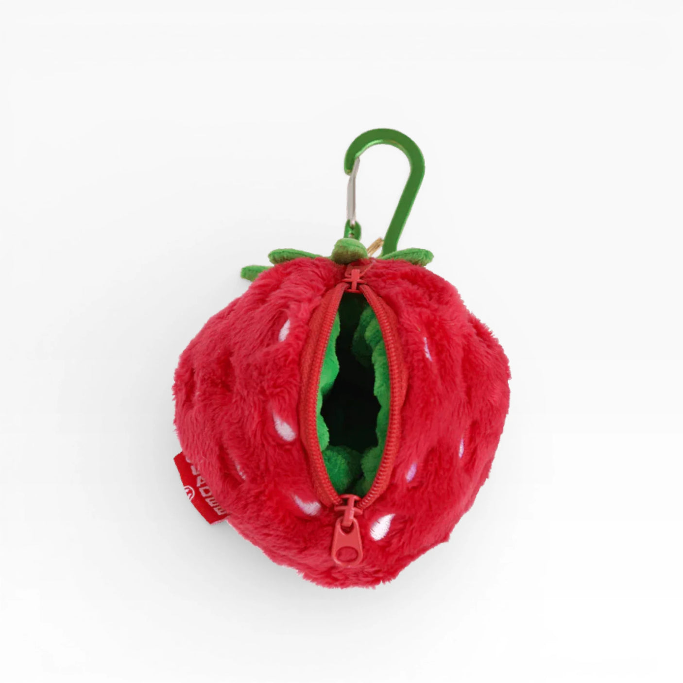 Plush strawberry AirPods case with zipper opening, red exterior and green leaves