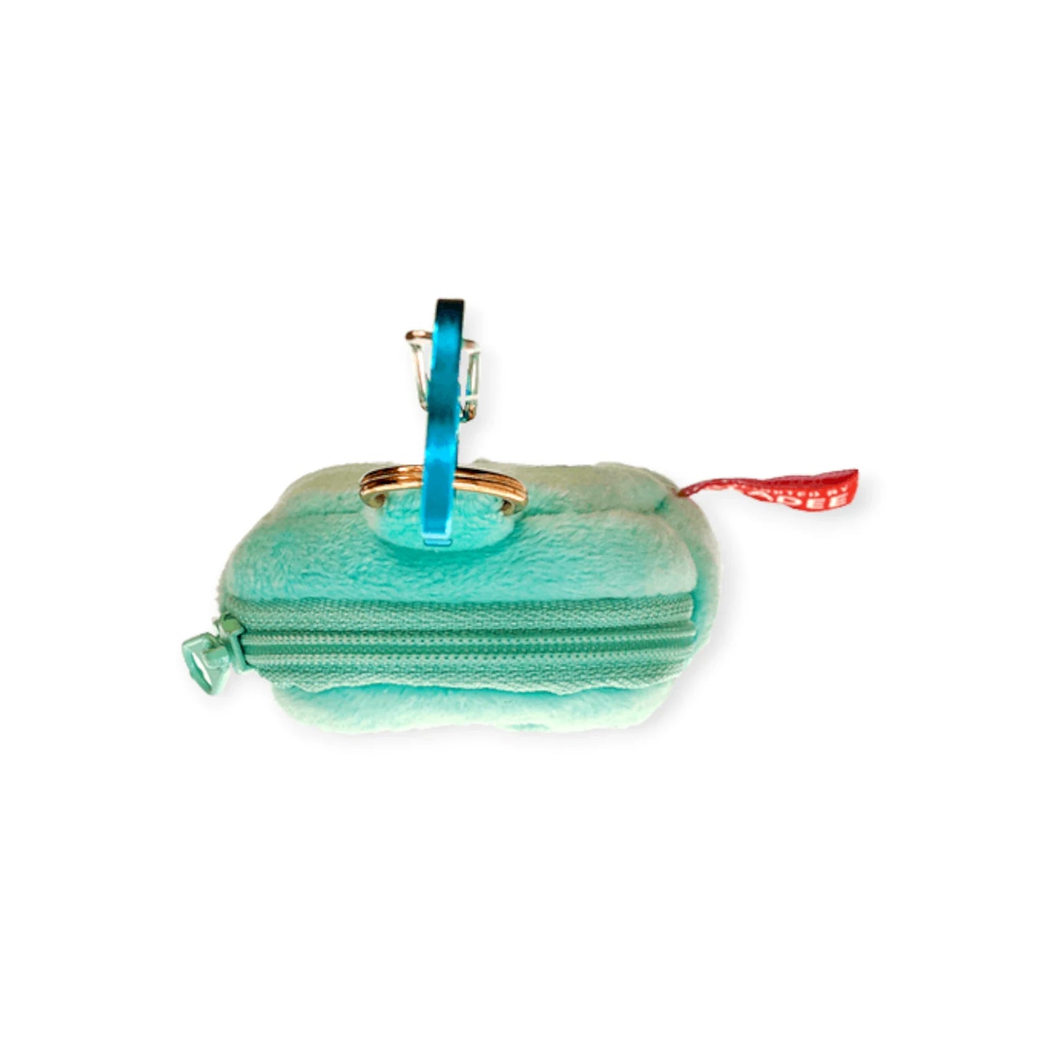 Mint ice-cream earbuds case open with zipper, teal key clip, and charm