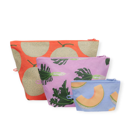 The Baggu Go Pouch Set - Japanese Produce features vibrant fruit and leaf designs, crafted from recycled materials. Available in large to small sizes and colors like orange, purple, and blue, this set offers a stylish touch of Japanese-inspired organization for your essentials.