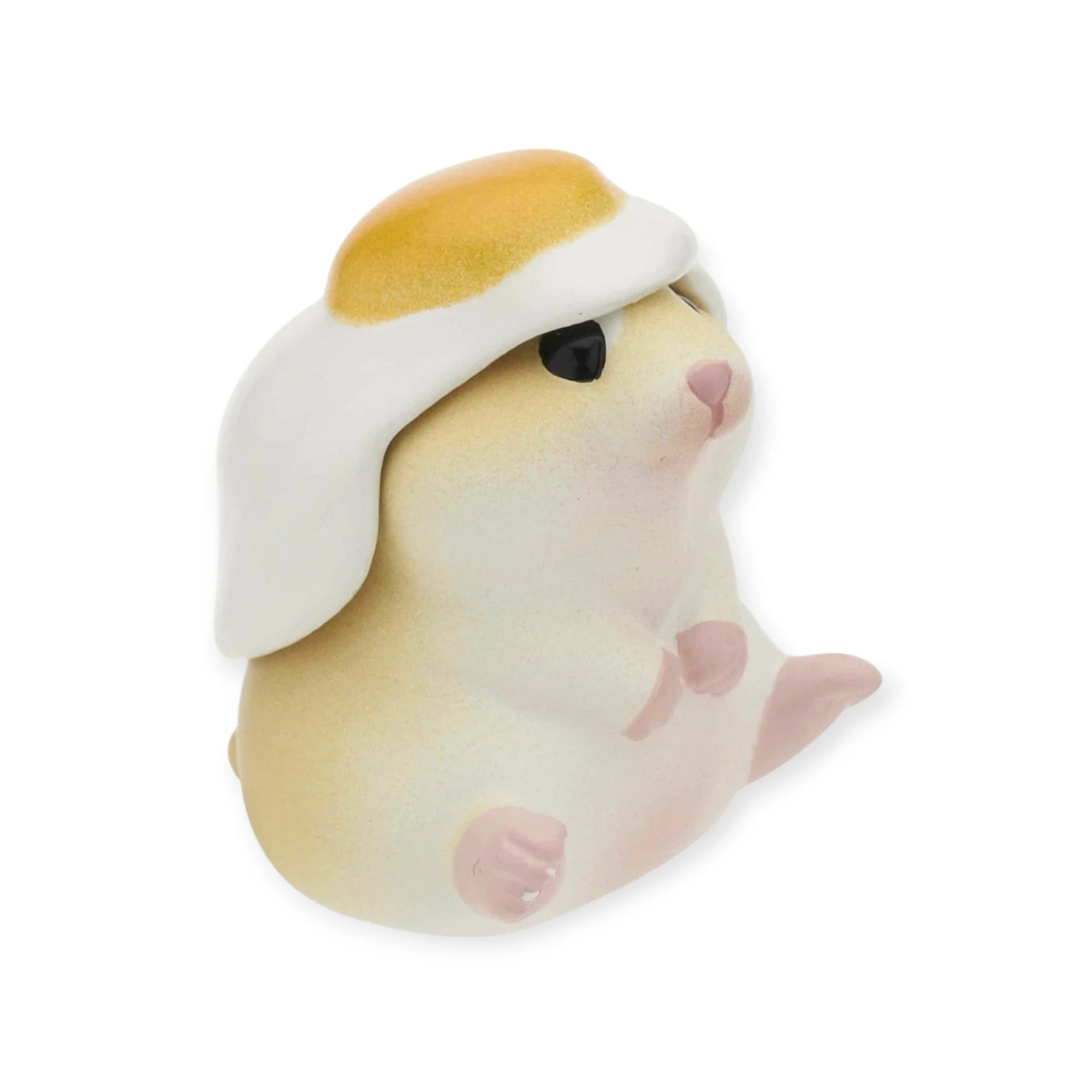 This charming small ceramic animal figure with a fried egg on its head captures the whimsical essence of Kitan Club's Hamster ‘N Egg Blind Box collection.