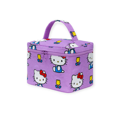 The Baggu Hello Kitty x Baggu Large Cosmetic Case is a rectangular purple bag with a handle, featuring cartoon cat faces and yellow tulips—playful and perfect for storing cosmetics or lunch.