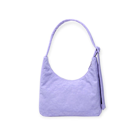The Hello Kitty x Baggu Mini Nylon Shoulder Bag by Baggu is a lavender mini shoulder bag with a single strap and bow detail, made from recycled nylon and shown against a white background.