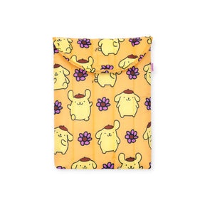 The Baggu Hello Kitty x Baggu Puffy Laptop Sleeve 13"/14” – Pompompurin features a playful yellow dog and purple flower pattern on an orange fabric pouch with flap, perfect for fans of Pompompurin.