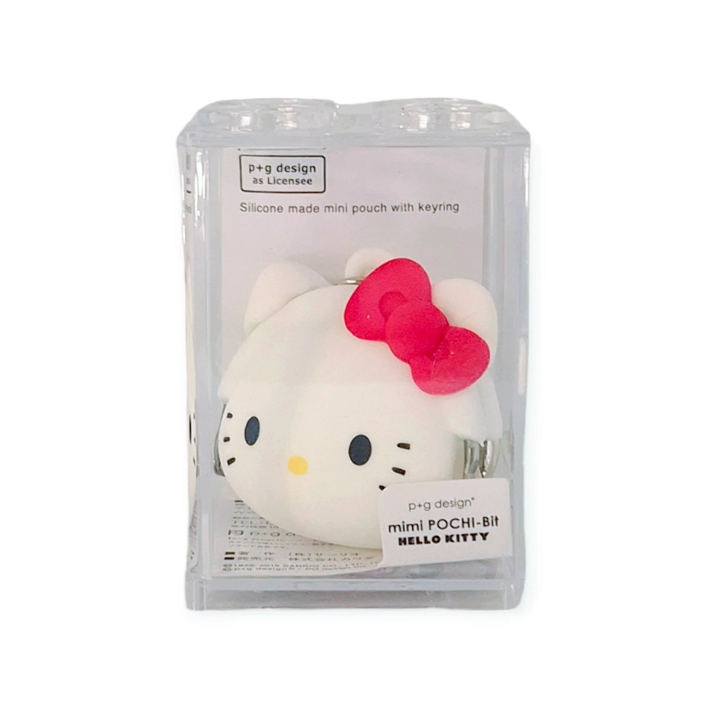 Mini coin pouch keychain of Hello Kitty, white with red bow, shown in clear box