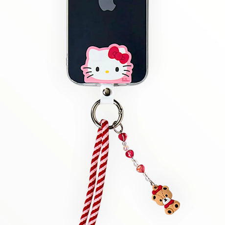 Hello Kitty phone strap with red-and-white striped cord and teddy bear charm