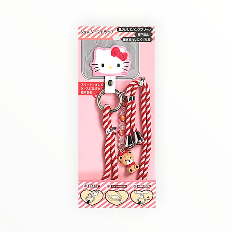 Hello Kitty phone strap in retail package with striped cord and teddy bear keychain