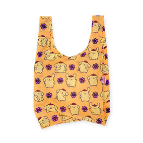 The Standard Baggu x Hello Kitty - Pompompurin by Baggu is an orange recycled nylon shopping bag featuring a repeating pattern of cartoon dogs and purple flowers on a solid background.