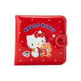 The Retro Hello Kitty Red Wallet, by Hello Kitty, features an adorable kitty with a brown teddy bear design. It has polka dots and "Hello Kitty" text, offering vintage charm and smart storage for essentials.