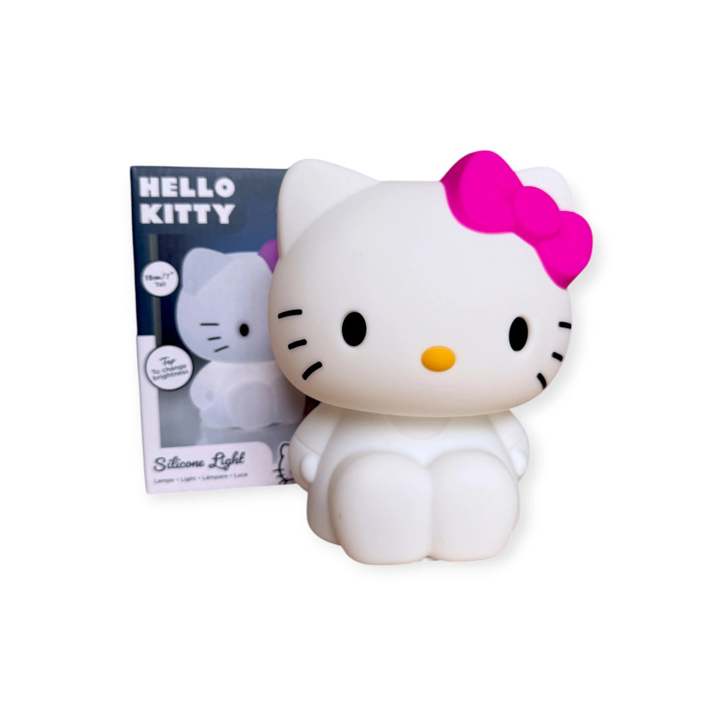 Hello Kitty Silicone Night Light with a pink bow, featuring a squishy silicone design in a charming sitting pose next to its box labeled "Hello Kitty.