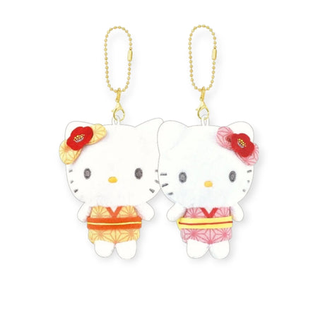 A pair of plush Hello Kitty Twin BFF keychains dressed in yukata-style outfits with floral hair accessories, attached to gold chains.