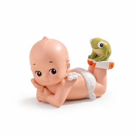 Kewpie blind box figure crawling while holding a green turtle on an orange base