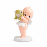 Kewpie holding things blind box figurine holding a small yellow fish