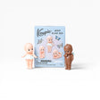Kewpie Minis blind box package with pictured pink and brown baby figures