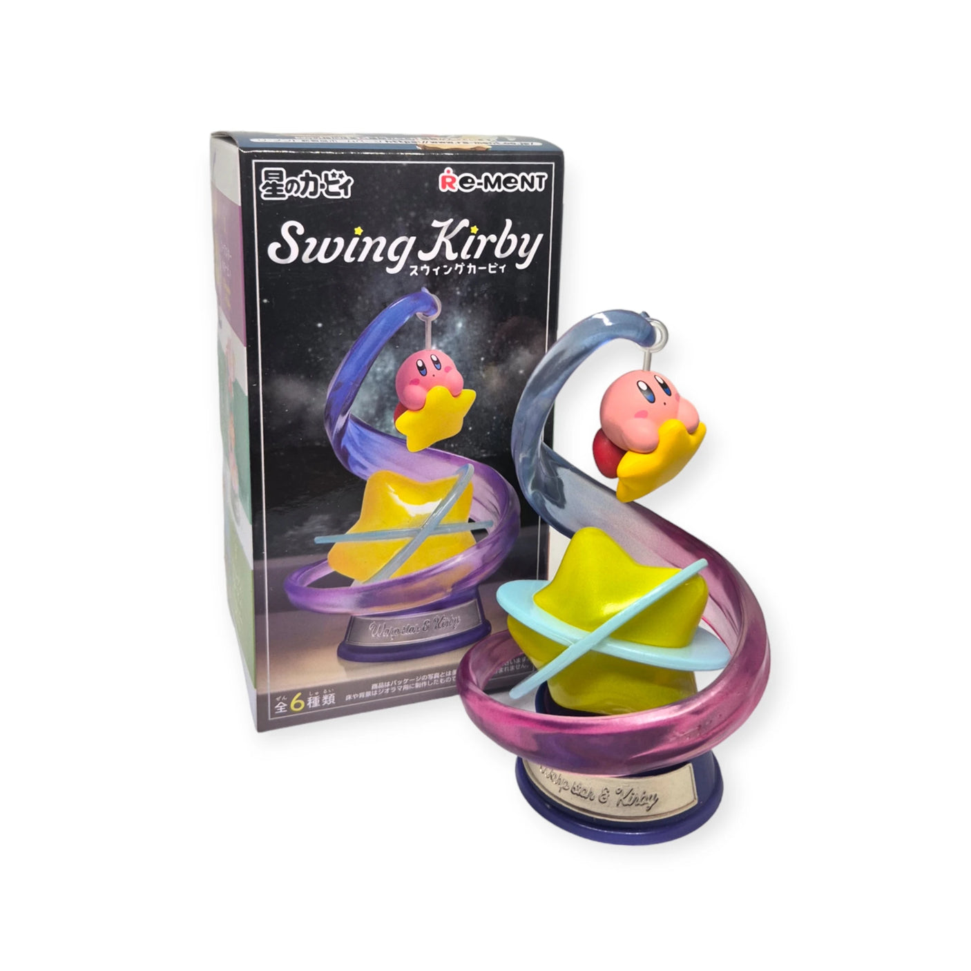 A Re-Ment Kirby Swing Blind Box toy figure is shown in front of its packaging, featuring Kirby holding a star amidst a colorful spiral. The box reads "Re-Ment Kirby Swing Blind Box," suggesting additional collectible Kirby characters to explore.