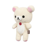 The Rilakkuma Korilakkuma Small Plush - 20cm features beige fur, pink ears, a white belly, red chest button, and brown side tag—crafted for premium softness and showcasing Korilakkuma’s playful charm.