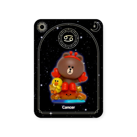 The Kwistal toy bear by Mighty Jaxx wears a crab hat and holds a small yellow duck on an orange base, with a starry backdrop and Cancer symbol, capturing the excitement of the Mighty Jaxx - Kwistal Line Horoscope Primus Blind Box.