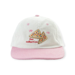 White corduroy cap with pink brim embroidered with colorful fairy bread slice and Lies Collective text on front panel