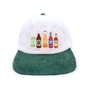 White corduroy hat with green brim and beer bottle graphic