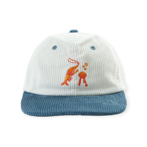 White corduroy cap with blue brim featuring embroidered orange shrimp and barbecue grill on front panel
