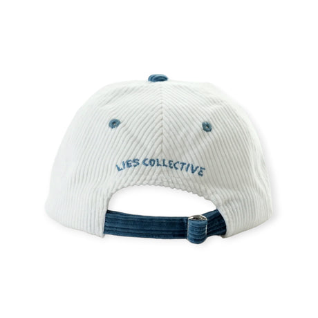 Back view of off-white corduroy hat with navy adjustable strap and blue embroidered Lies Collective logo above opening