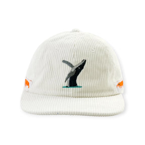Off-white corduroy hat featuring embroidered breaching whale on front and small orange sea creatures on sides