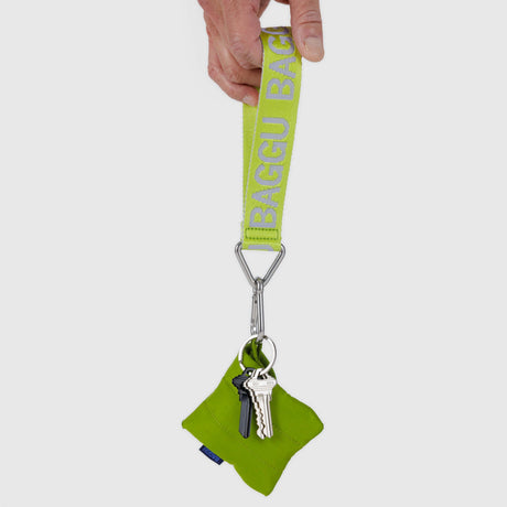 Citron green Baggu logo keychain with metal rings and small green charm pouch