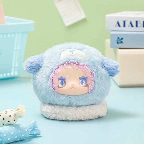 Blue plush Lovely Emma Rua Rua Zoo bag charm in sheep costume with ruffled hood on pastel blue background