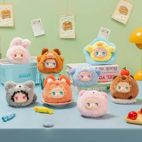Eight Lovely Emma Rua Rua Zoo plush bag charms dressed as various cute animals displayed on pastel table with books and candies