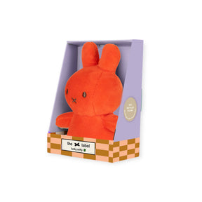 Coral mini plush rabbit charm with embroidered face, shown in gift box