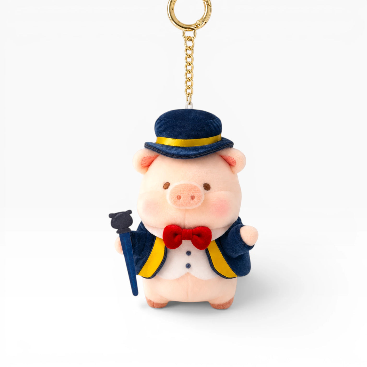 Plush pig keychain with blue top hat, red bow tie, and gold key ring