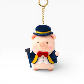 Plush pig keychain with blue top hat, red bow tie, and gold key ring