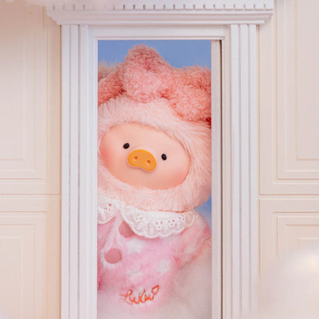 Cute LuLu Piggy plush pal in soft pink fuzzy pajamas with lace collar peeking through doorway against blue sky background
