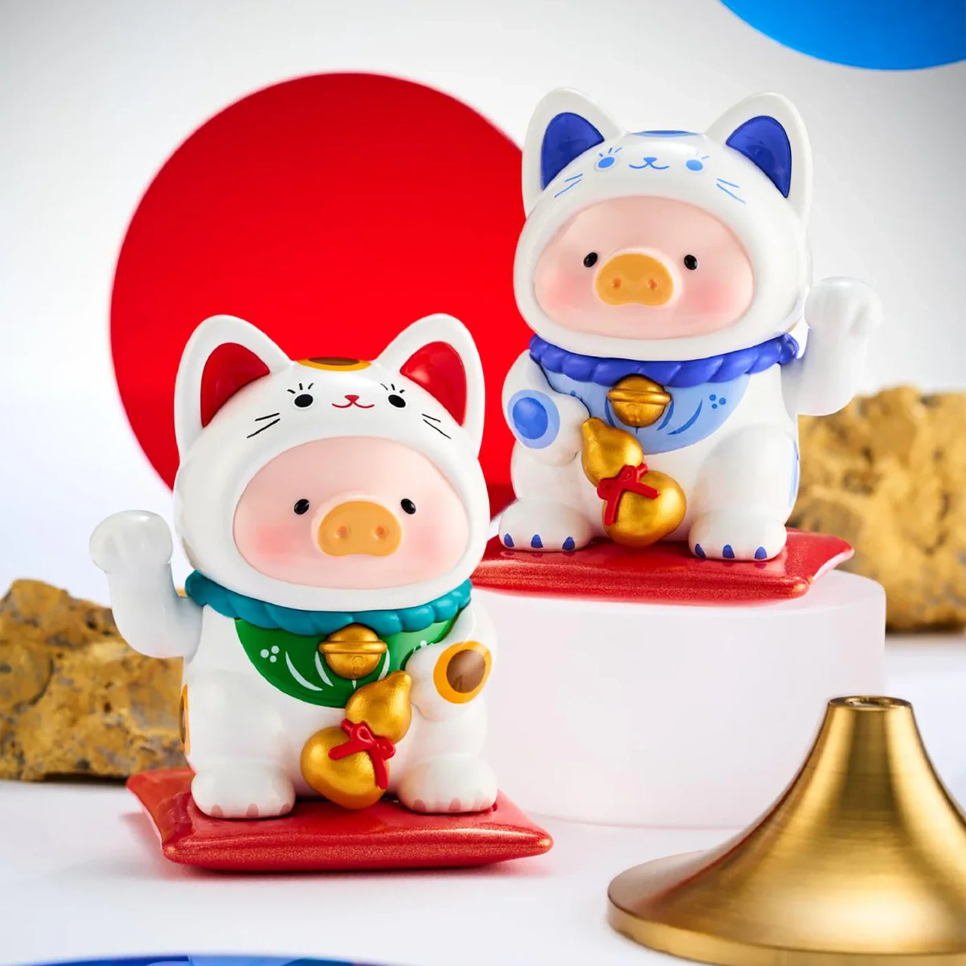 LuLu The Piggy - Lucky Cat Blind Box showing two piggy figurines dressed in white cat costumes with gold bells by LuLu The Piggy