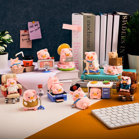 Piggy blind box figure set arranged on a desk with books, binders, and office items