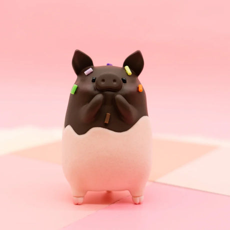 LuLu the Piggy Original Series 2 figure 9 in chocolate coating with colorful sprinkles on pink checkered surface