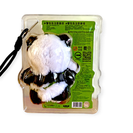 Rear view of LuLu the Piggy plush keychain in panda costume inside clear plastic packaging with warning label, gallery 1
