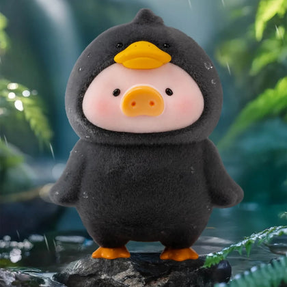 Penguin-themed piggy plush figure, dark fabric with orange beak and feet