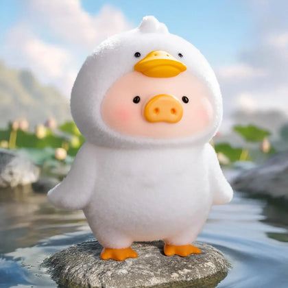 Pig blind box figurine in white hooded outfit with orange beak and egg-shaped face
