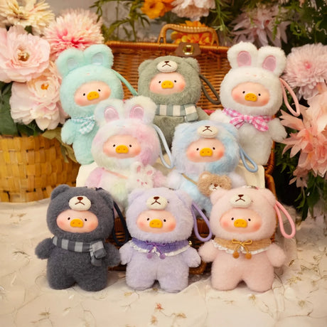 Nine Joyful Time LuLu The Piggy Plush Pals by LuLu The Piggy, dressed in pastel animal outfits with duck faces, sit before a basket of pink flowers—perfect as keychain plush or for your Plush Pal Blind Box collection.