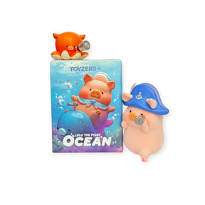 LuLu The Piggy - Ocean Blind Box toy packaging features a pig figurine in a blue sailor hat with a small orange sea creature, perfect for ocean adventure fans. From the LuLu The Piggy brand.