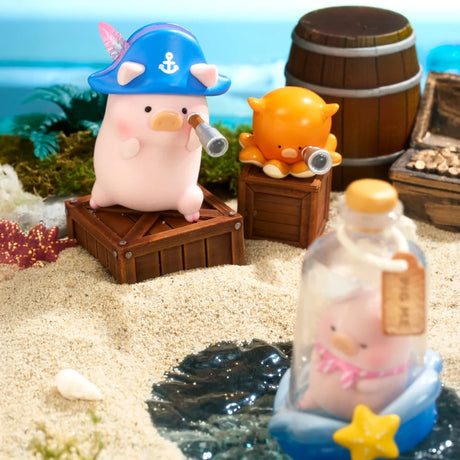 On a sandy beach, LuLu The Piggy - Ocean Blind Box figures—a pirate pig, a crab with telescopes, and another pig in a bottle—create an ocean adventure scene with barrels and seashells. Collect these whimsical LuLu The Piggy toys!.