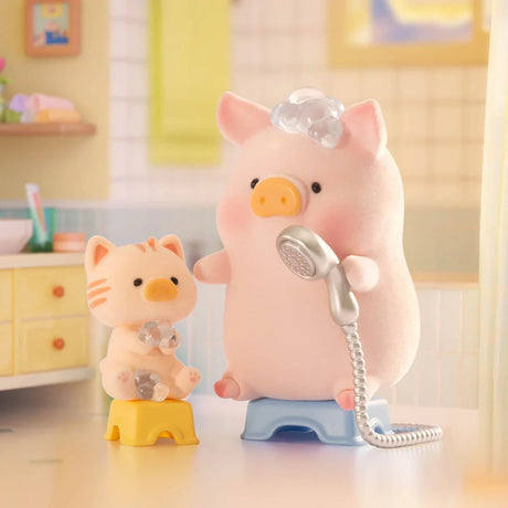 LuLu The Piggy and a plush cat sit on stools in the bathroom, pretending to shower with a toy showerhead and covered in bubbles—a perfect scene for fans of the LuLu the Piggy - Stay With You Blind Box by LuLu The Piggy.