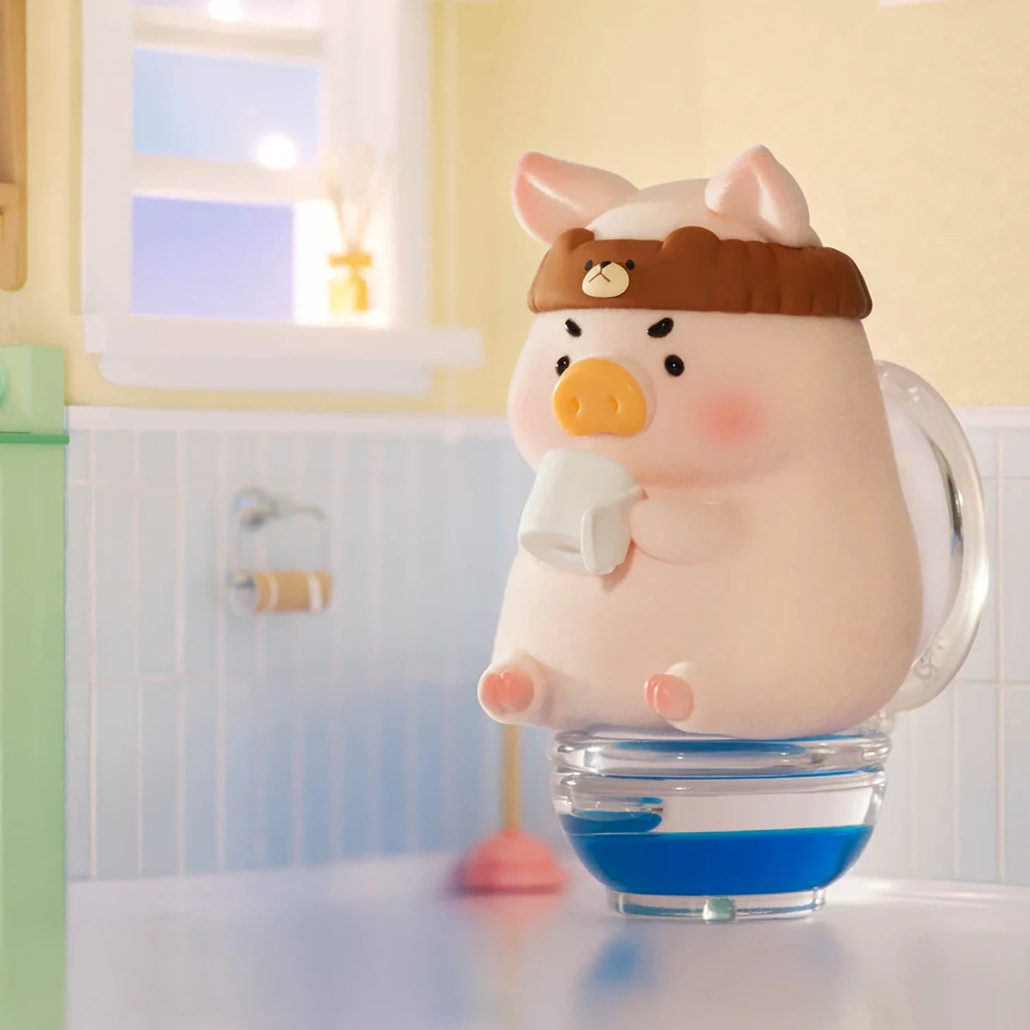 LuLu The Piggy - Stay With You Blind Box by LuLu The Piggy features a plush figure with a brown headband, sitting on a glass cup and holding a white mug in a pastel bathroom scene.