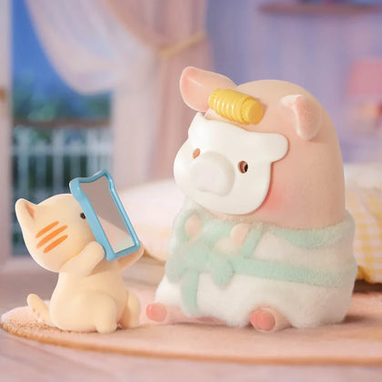 White and pink piggy blind box figures with blue tablet and fuzzy outfit