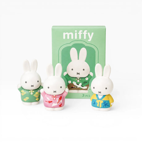 Miffy blind box 3pc set: three white bunny figurines with colorful outfits in front of box