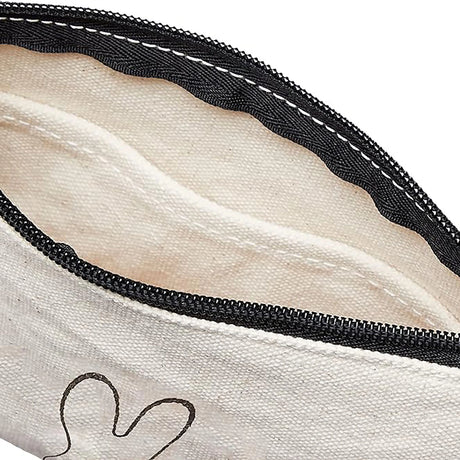 Off-white canvas zipper pouch interior with black zipper and stitched seams