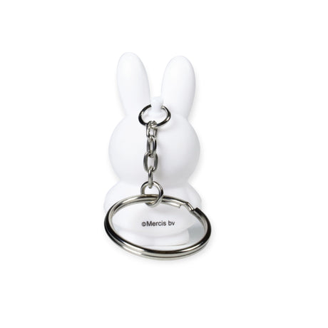 The Miffy Bunny Keychain - White by Miffy is a white rabbit-shaped keychain that boasts a minimalist style and includes a metal chain and ring.