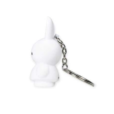 Side view of the Miffy Bunny Keychain - White, featuring a minimalist rabbit-shaped design with a metal ring, isolated on a white background.