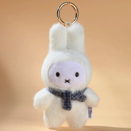 The VIPO x Miffy Macaron 2 Plush Keychain - Blind Box by Miffy features a cute white plush with a simple face and black scarf, set against a beige background—ideal for pastel Miffy fans or collectors wanting a fun surprise.