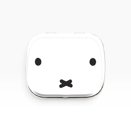 Miffy bunny pill tin with white lid and black bunny face design